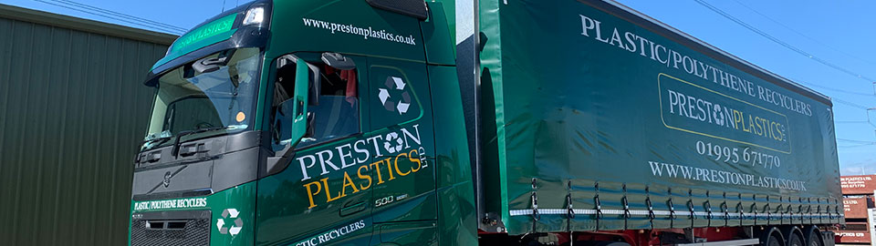 A black lorry/truck emblazoned with Preston Plastics branding.